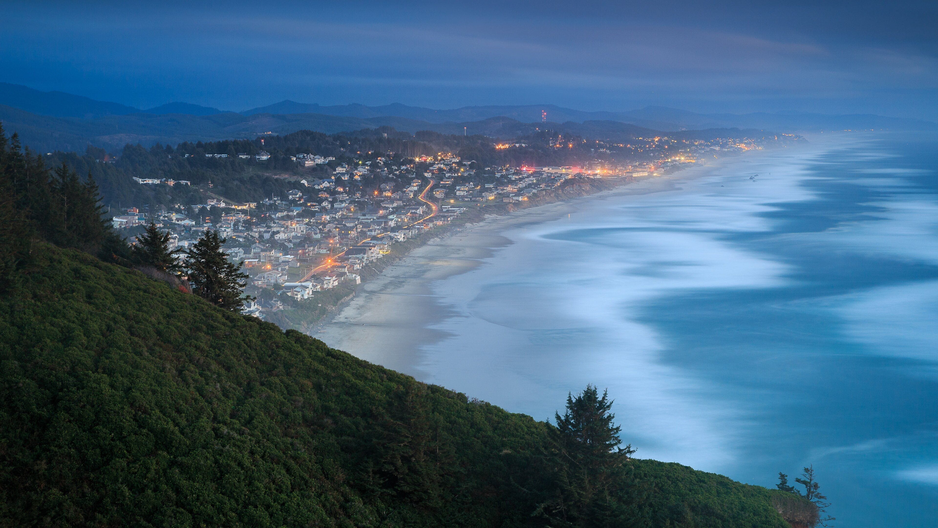 Lincoln City featuring night scenes, a coastal town and general coastal views