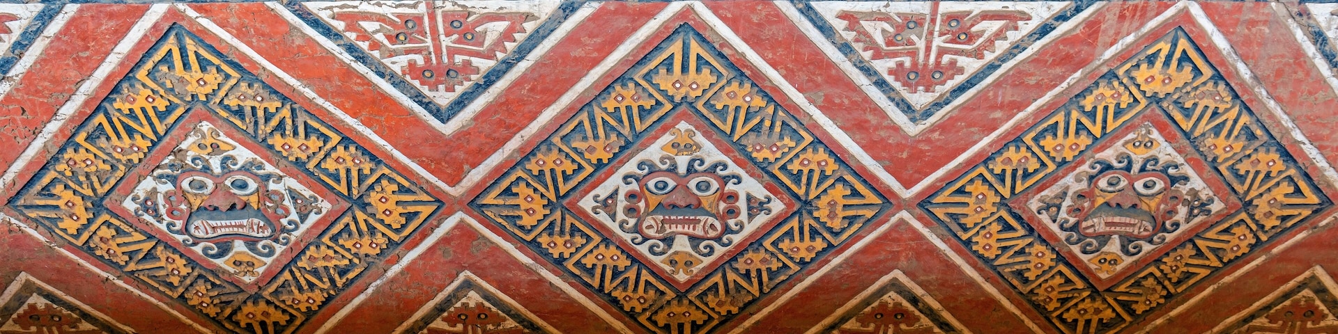 Bas relief Panorama of the Moche God Ai Apaec in a tomb of the Huaca de la Luna, Trujillo, Peru. Ai Apaec was worshiped as the creator god, protector of the Moche civilization.