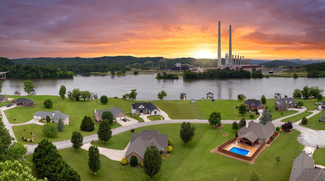 Suburban houses in residential neighborhood near Kingston Steam Plant in Roane County, Tennessee. Major coal-fired power plant producing electricity. Fossil fuel usage for energy production