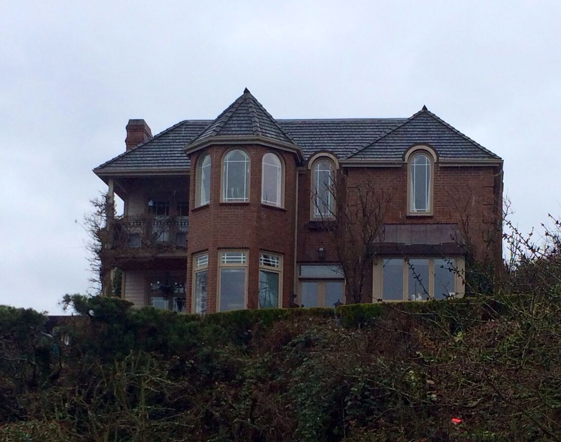 Cool house across the street from the park! I was tempted to make the picture black-and-white so it would look like a house from a movie about a haunted house. It definitely made me think of Stephen King's Rose Red.