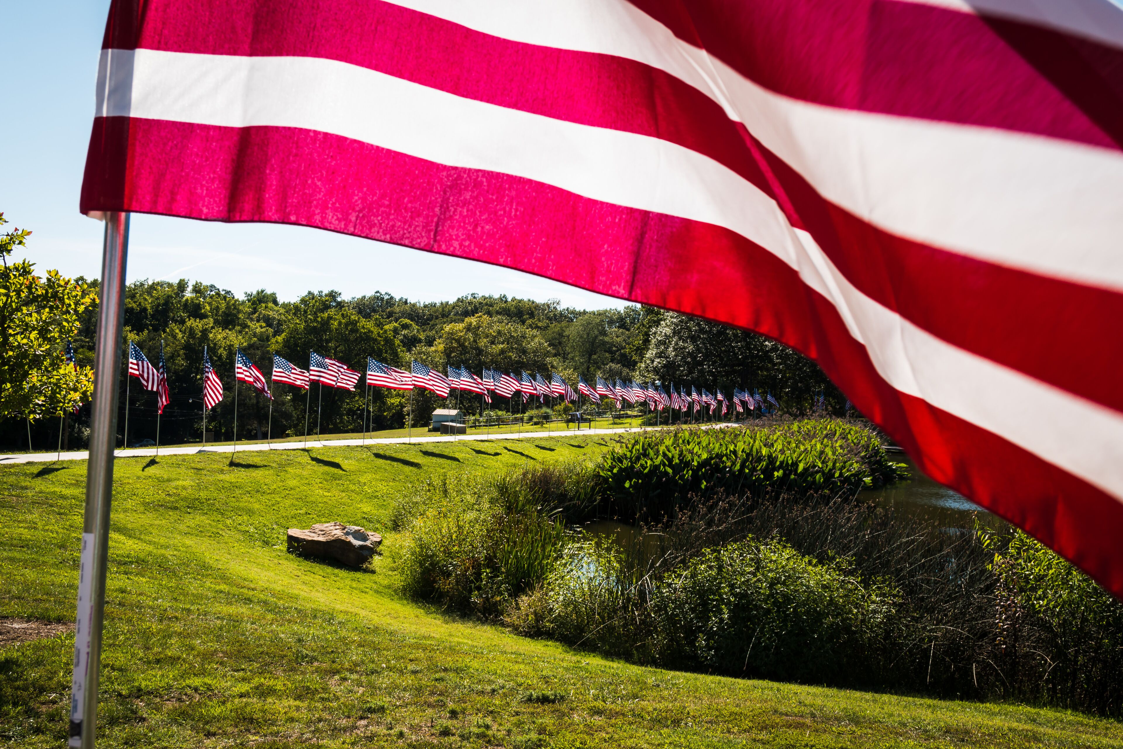 Visitors at Walker Lake in Kirkwood, Mo., view memorial flags in tribute to 9/11 first responders on Sept. 13, 2015.