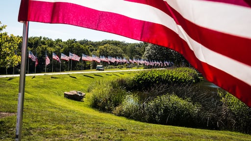 Visitors at Walker Lake in Kirkwood, Mo., view memorial flags in tribute to 9/11 first responders on Sept. 13, 2015.