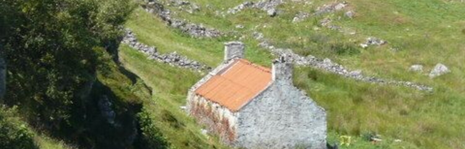 Derelict cottage at Culkein Drumbeg The jetty and Oldany Island in the distance.
