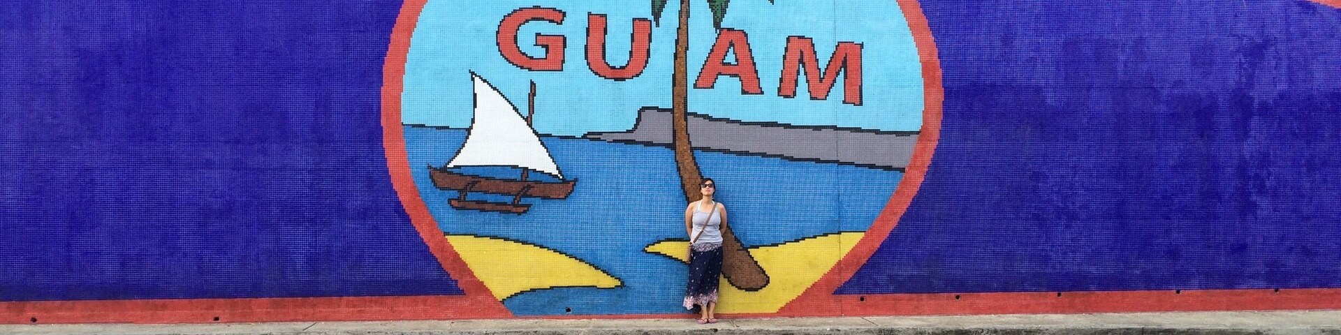 When in Guam... Take this mandatory shot. It's a mural made of tiles but from afar this looks like an ordinary painted wall.