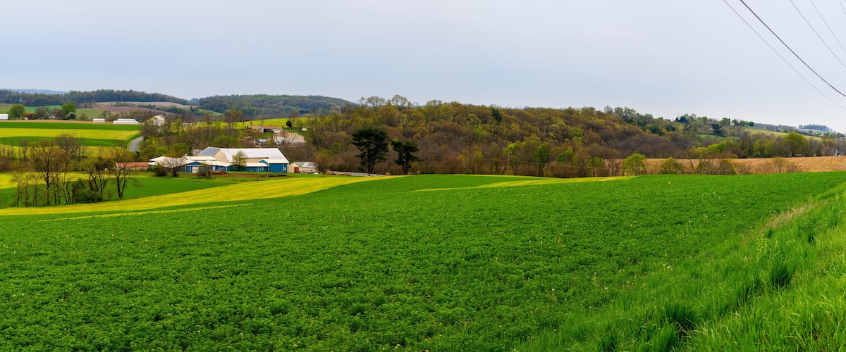 Pennsylvania countryside and farms in spring near Kutztown. Fields just starting to be plowed.