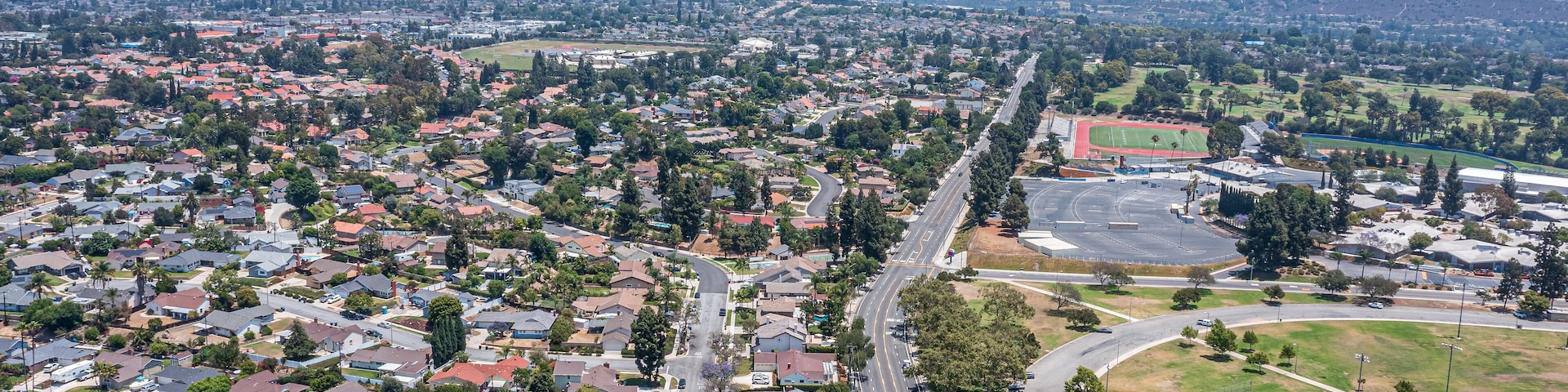 Aerial view of sports park in suburban California neighborhood.