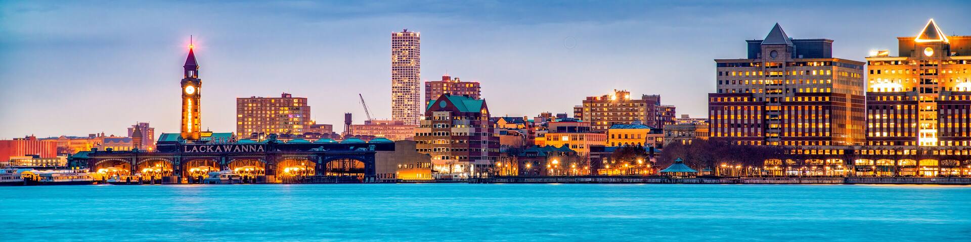Jersey City, NJ - December 1st, 2018: Buildings of Jersey City at night along Hudson River