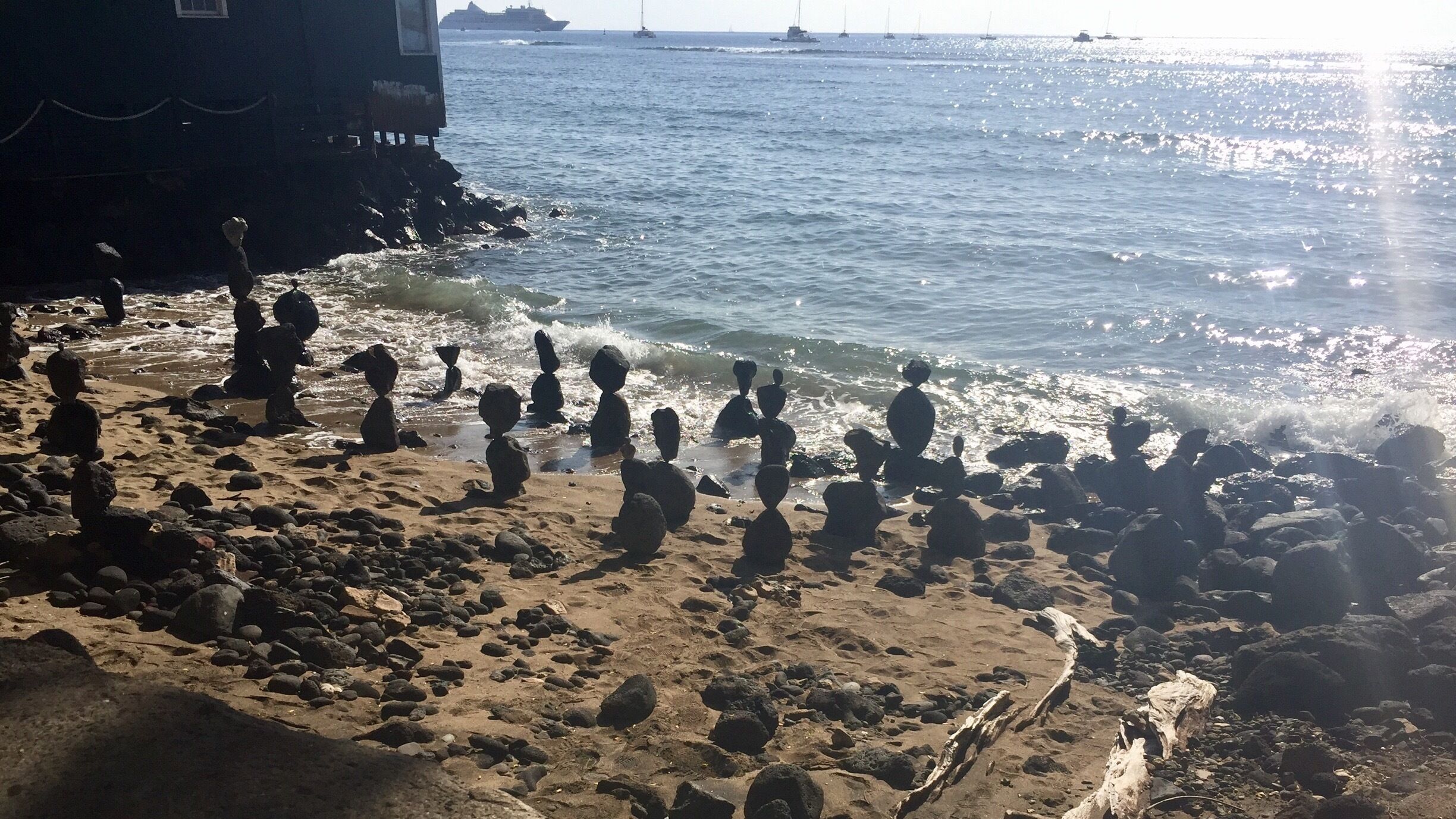 This man comes to this spot between 2 shops in the middle of Lahaina every year for the last 15 years. He becomes one with the rocks and balances them! Healing for him and amazing to watch him!