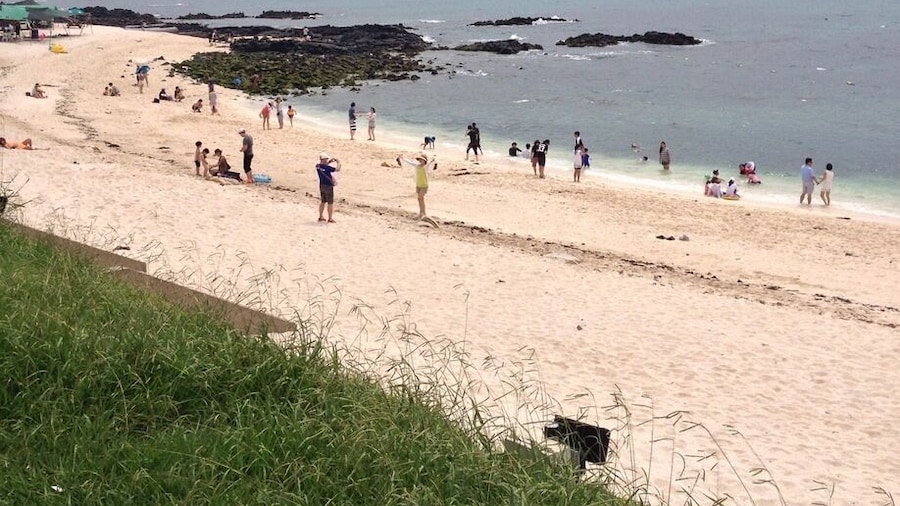 Koreas only white coral beach on Udo island, off the coast of Seongsan on Jeju-do. Stunning beach, clear waters and views of Seongsan mountain.