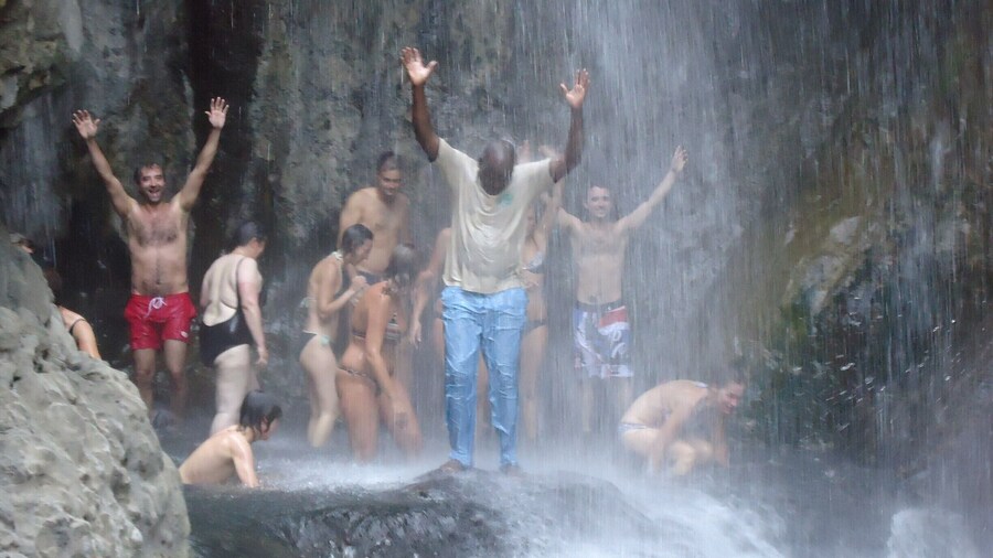 This tourist decided to have a swim at the waterfalls with their guide Steven, but steven refused to put in a swim suite claiming that he was a married maasai.