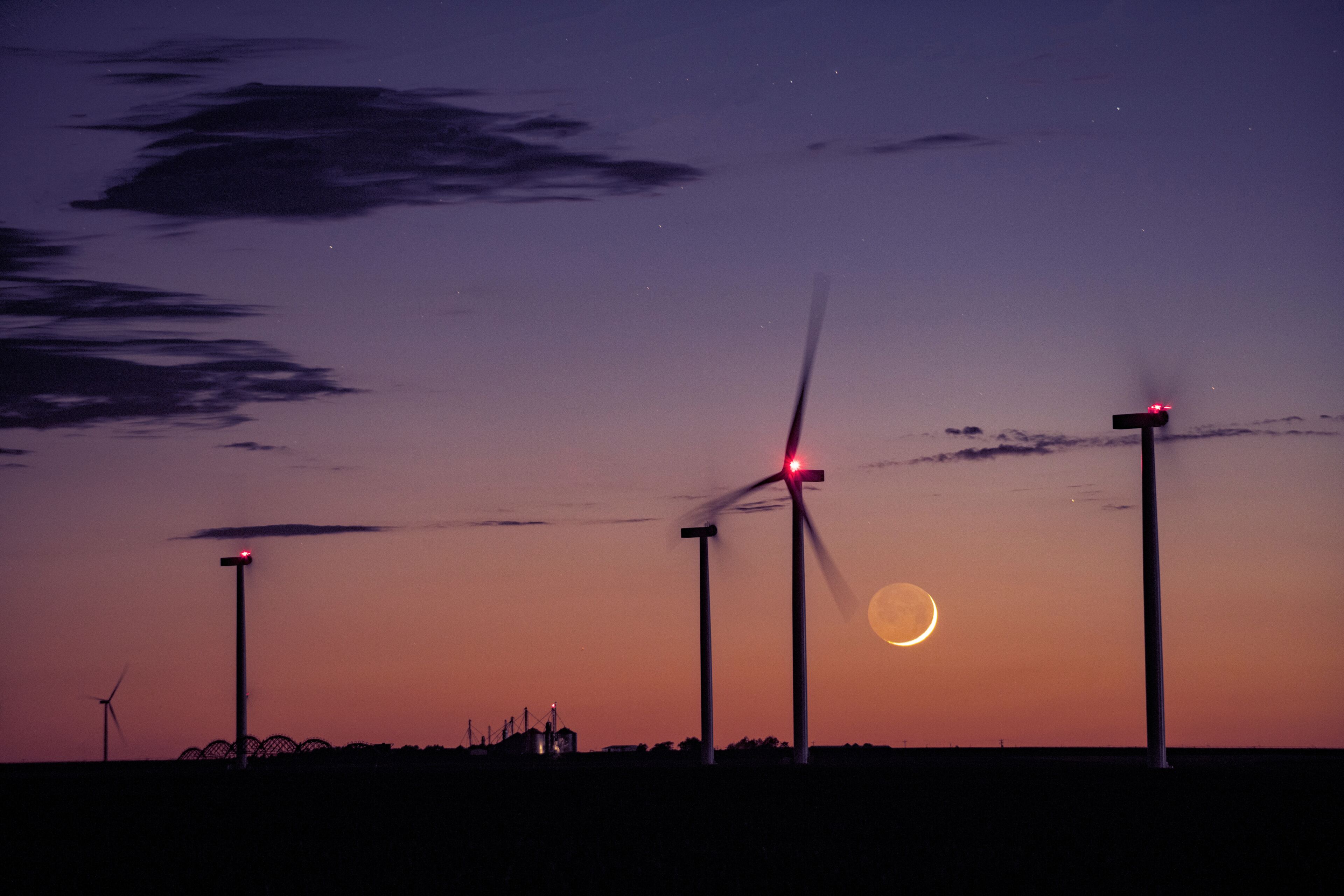 Cresecent Moon Sets Behind Wind Turbines