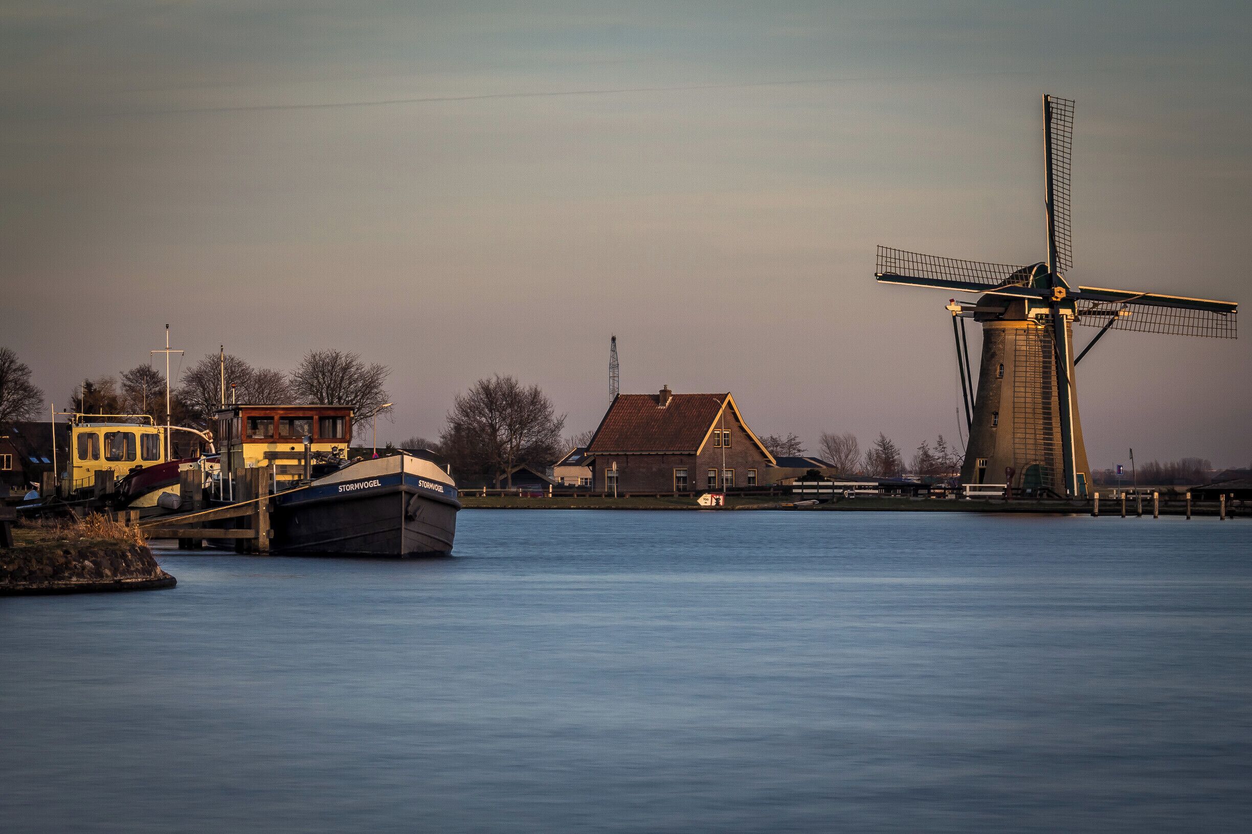 Windmills and waterways just outside of Leiden city. Classic dutch scenery.