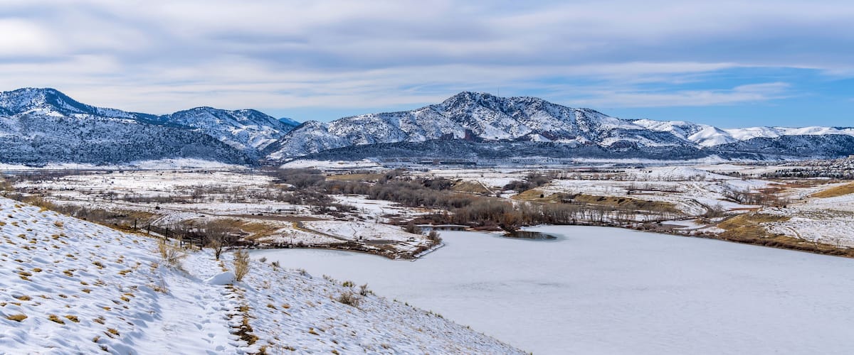 Winter Park - A bright sunny Winter day overview of snow-covered Bear Creek Lake Park, as seen from Mt. Carbon. Denver-Lakewood-Morrison, Colorado, USA.