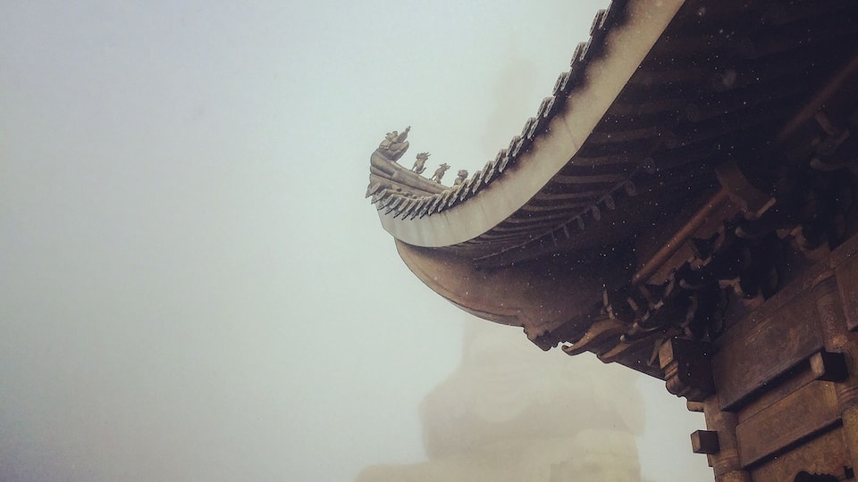 at the top of emei mountain.a temple glad by gold.