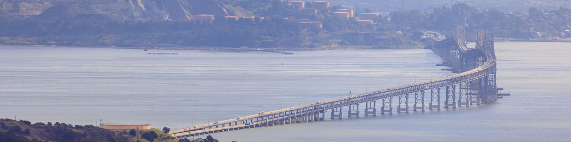 Richmond - San Rafael Bridge curves over San Francisco Bay on hazy day