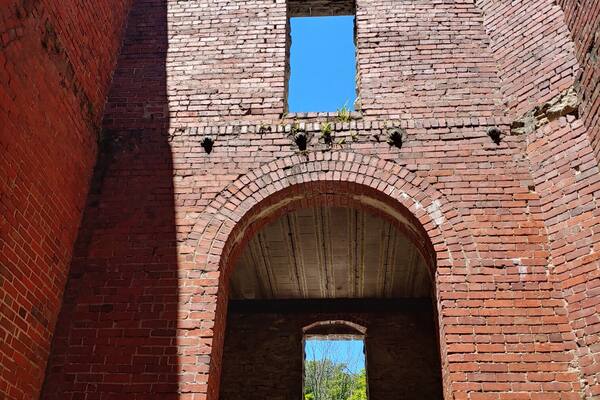 Not so much a castle, as the shell of a gatekeeper's house built around 1897.
It was more or less abandoned until the Cleveland Metroparks bought the land in 1925. The Metroparks removed the second floor and filled in the basement.