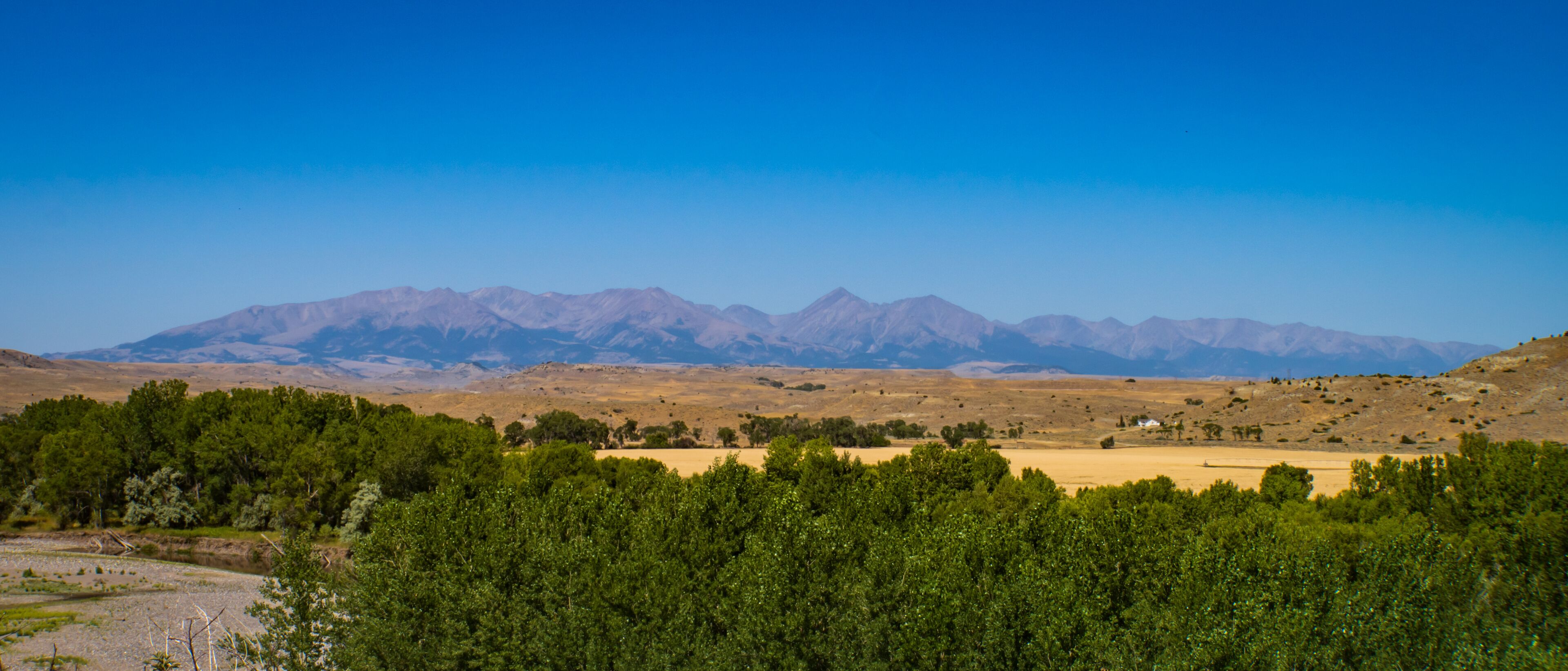A mountainous landscape with a clear sky.