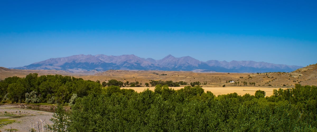 A mountainous landscape with a clear sky.