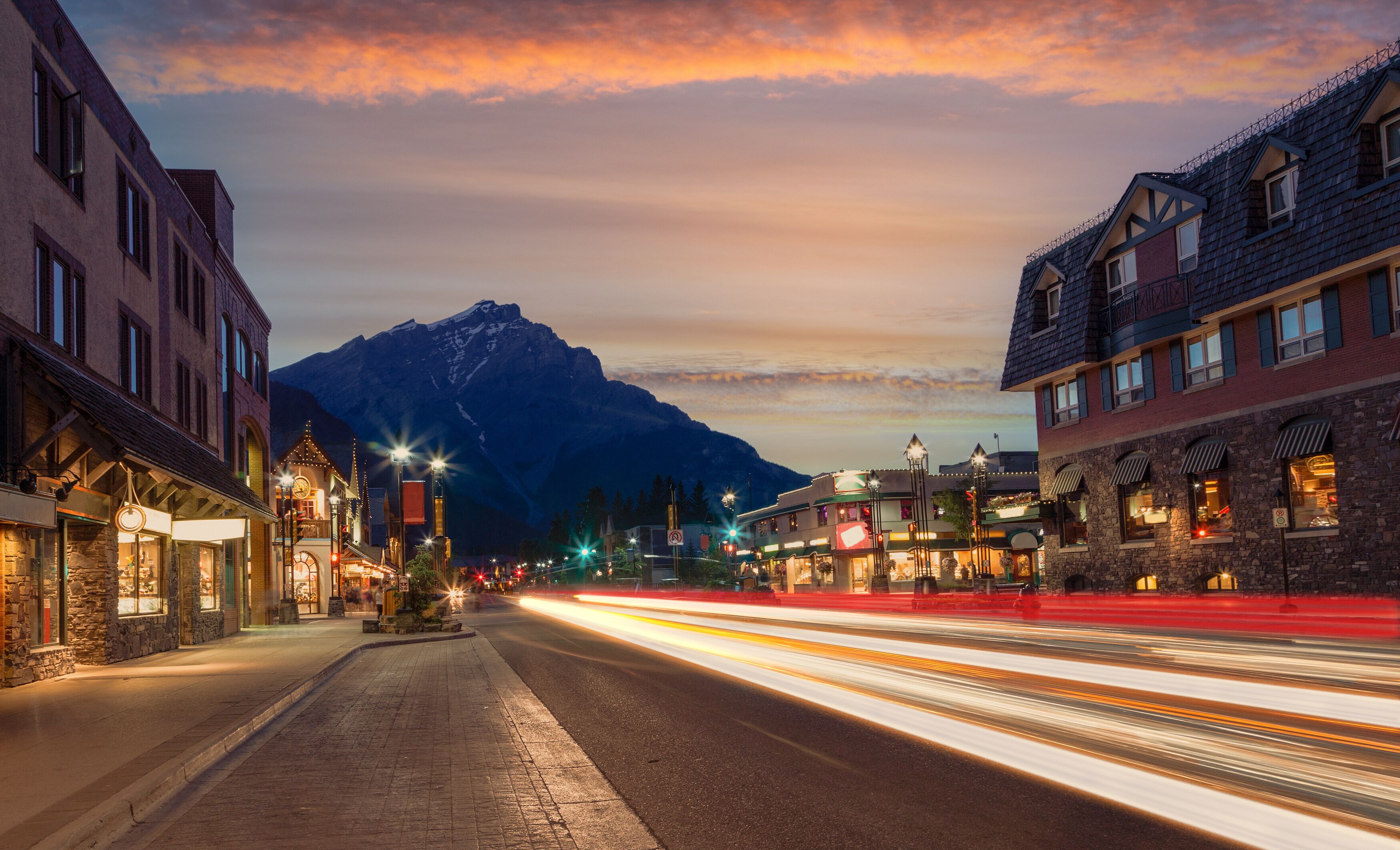 Golden Sunset On Banff Avenue in the National Park With Light Trails From Traffic Illuminating the Streets.