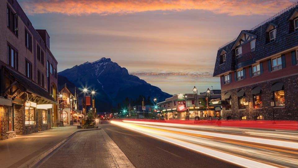 Golden Sunset On Banff Avenue in the National Park With Light Trails From Traffic Illuminating the Streets.