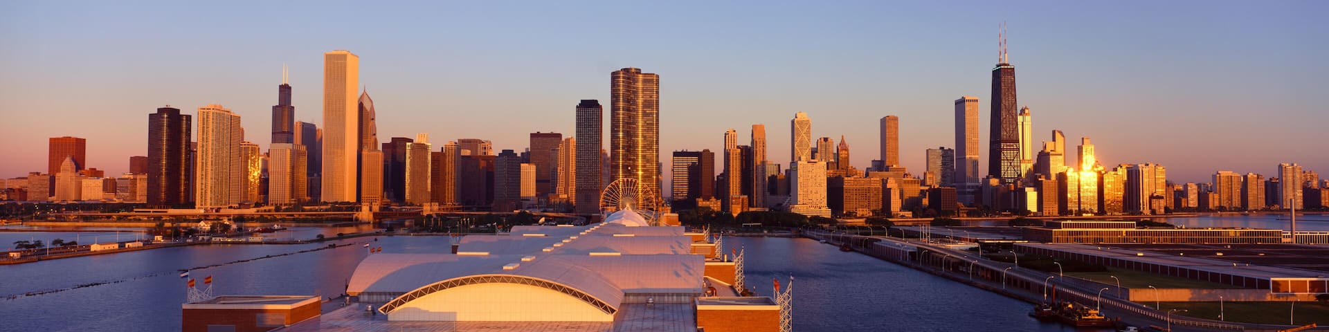 Panoramic view of Navy Pier and Chicago skyline at sunrise, Chicago, IL