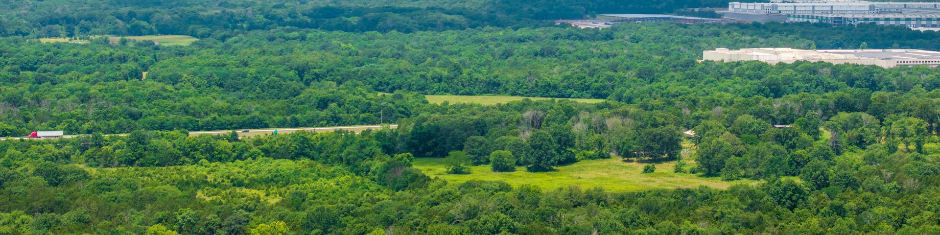 aerial shot of vast miles of lush green trees at the Nashville Superspeedway in Lebanon Tennessee USA