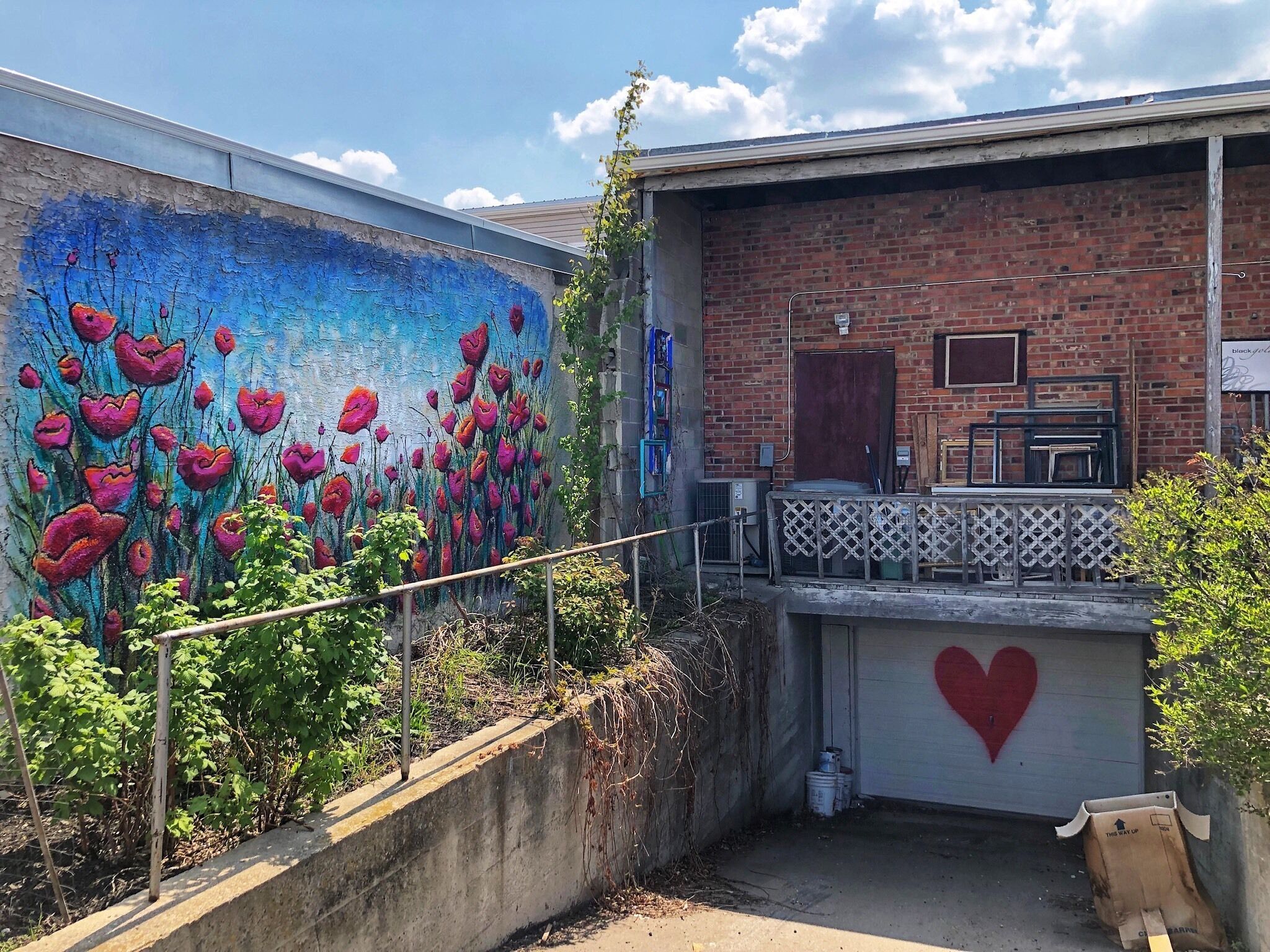 Mural in the backlane entrance of a picture framing shop in Downtown Leduc.