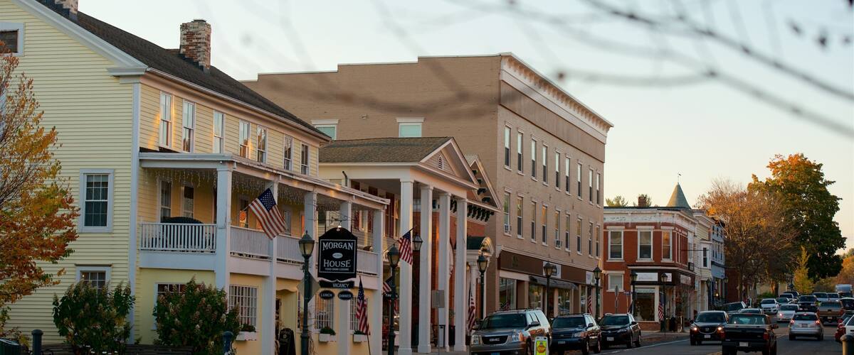 A street lined with historic buildings, including a Morgan House restaurant.