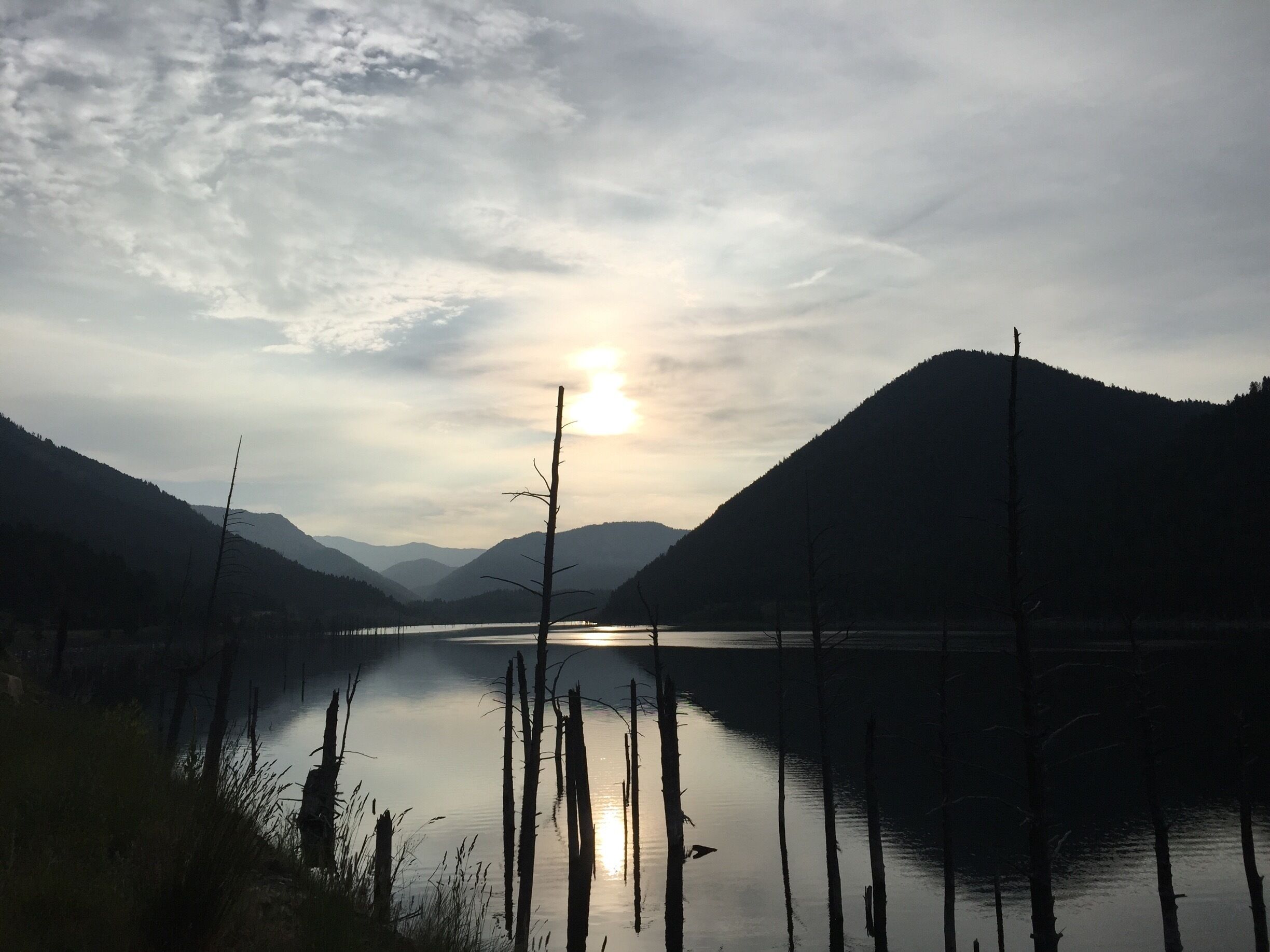 On August 17, 1959, a 7.5 earthquake occurred in southern Montana, killing 28 people and creating a lake. It is one of the more creepy places that I've been to. There are tons of bleached snags poking out of the water which in the evening become a popular nesting place for ravens. This photo was taken just after sunrise. #waterlust 