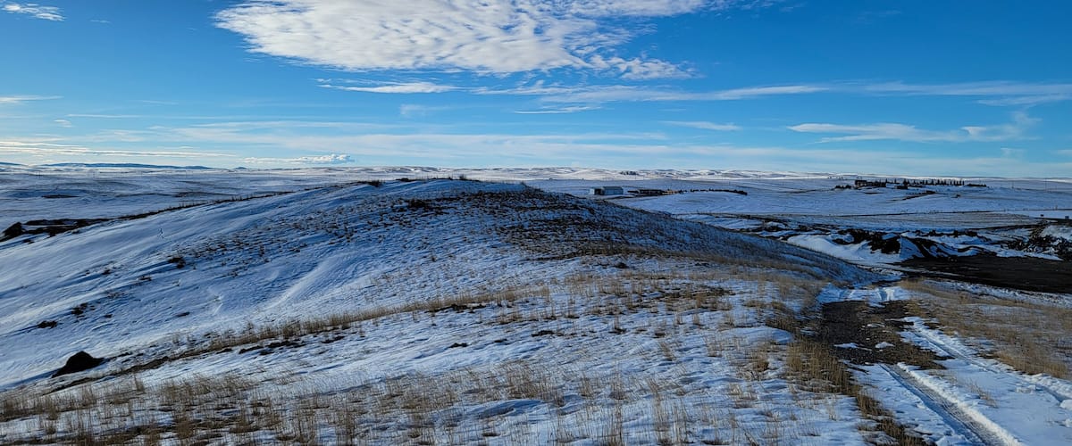 View from the snowcapped hill. Close to the dump in Lusk Wyoming, on a hill by the cemetery, the view is great with the snow on the ground. Trail road on the far right is the only way up and down.