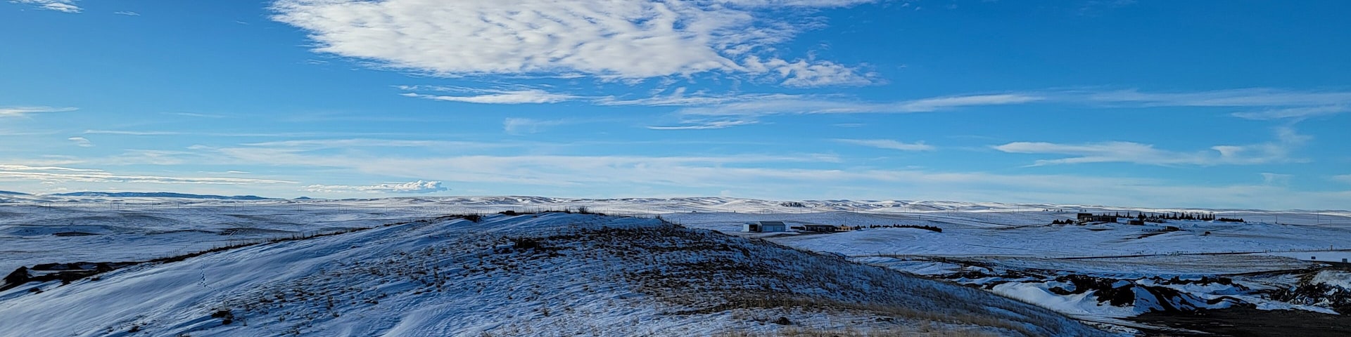 View from the snowcapped hill. Close to the dump in Lusk Wyoming, on a hill by the cemetery, the view is great with the snow on the ground. Trail road on the far right is the only way up and down.