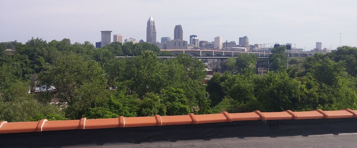 The view of downtown Cleveland from the roof of the Tremont Athletic Club in the former Fairmount Creamery Company building. Inner Bliss Yoga Studio offers rooftop yoga classes at this spot.