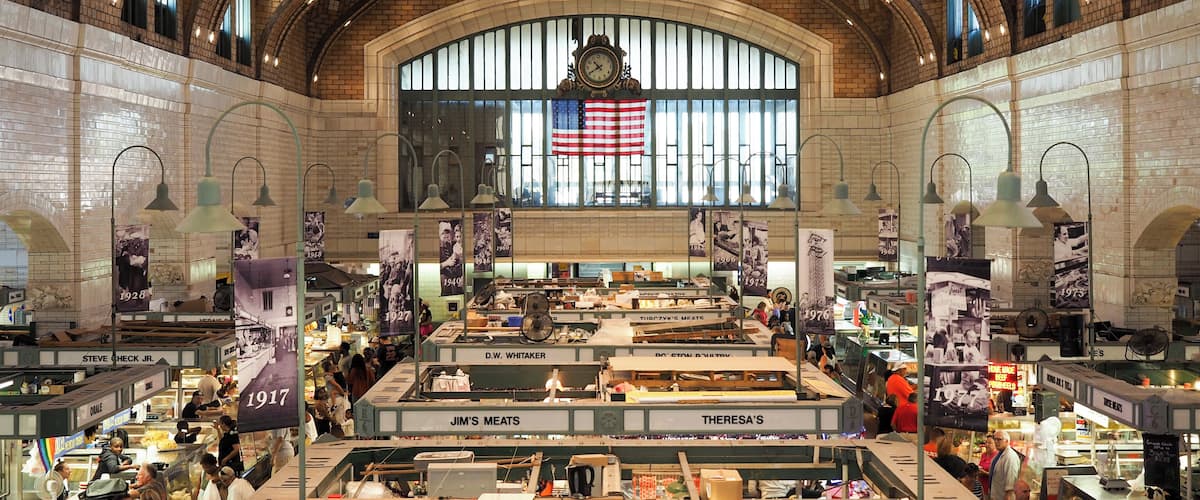 The West Side Market is home to dozens of vendors selling everything from fresh meat and produce to yummy baked goods to all sorts of specialty foods. It’s not just a fun place to take tourists, but also a place where locals frequently do their shopping.
To get this classic overhead view of the inside of the main market building, there’s a stairwell near the restrooms at the market’s entrance on W 25th. A quick flight of stairs, and you’ll be on the second-floor balcony with this great view.