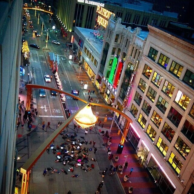 Playhouse Square in Cleveland, Ohio. We love our giant chandelier and our gorgeous theater district. There are 9 indoor Theaters and one outdoor plaza in the area. The Palace Theater is my personal favorite of course- sorry I'm basic. Eat at Cowell and Hubbard if you are dining before a show. They will make SURE you are on time for your curtain.

This was around a year ago during a police violence protest, hence all those people laying in the street below.
#theater #cleveland