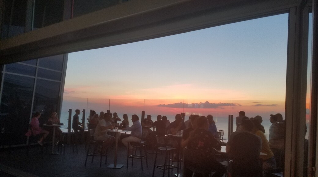 View of the July sunset over Lake Erie from inside the 32nd floor rooftop bar. This is atop the Downtown Hilton.
