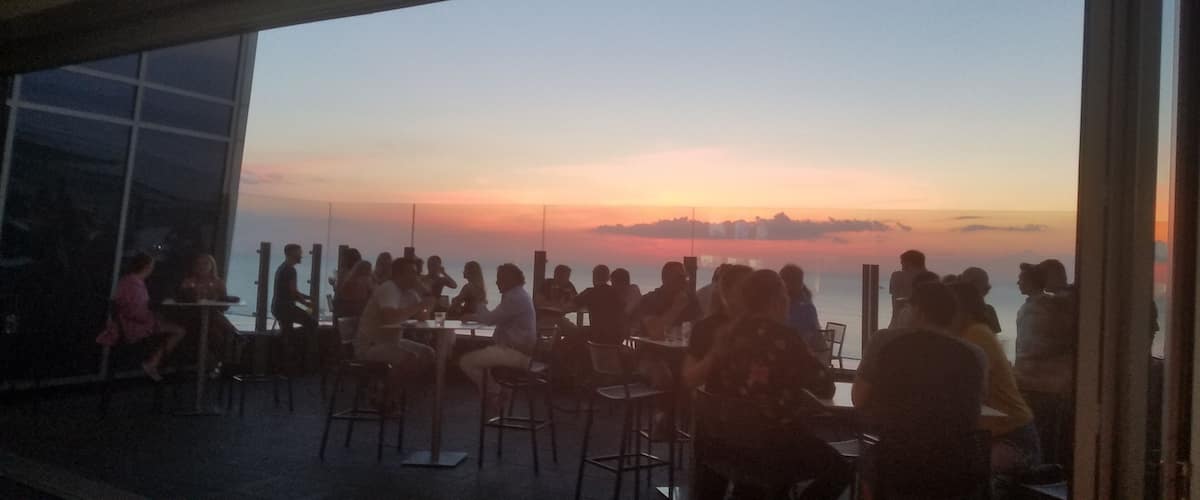 View of the July sunset over Lake Erie from inside the 32nd floor rooftop bar. This is atop the Downtown Hilton.