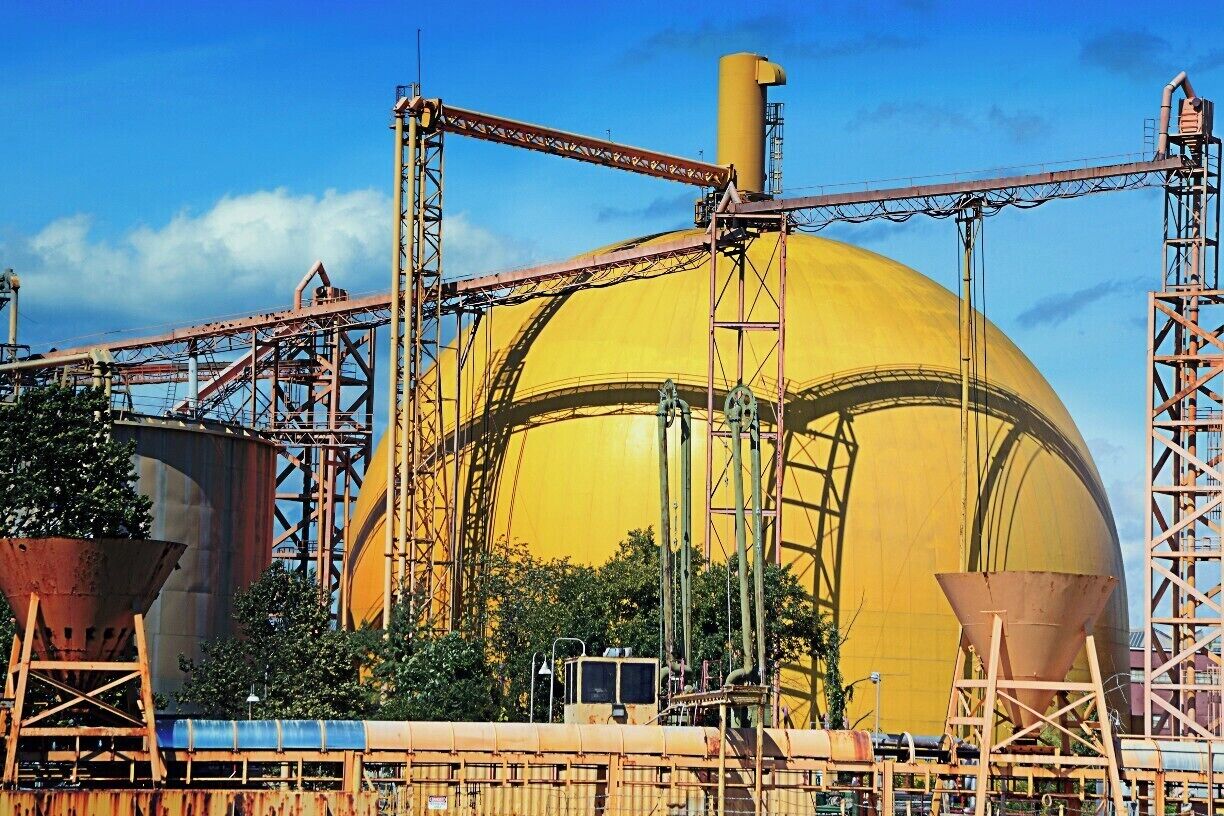 Cruising down the Delaware River, 30 miles north of Philadelphia, PA, USA. I found some interesting structures. This is an concrete containment  vessel that unloads dry concrete from ships coming up the Delaware River from the Atlantic Ocean. Riding up and down the river is interesting not only for the relaxing ride but for the interesting structures passing by. There are buildings, houses, steel mills, oil tankers, William Penn's house and large dump sites filled with iron and also your basic trash dumps as well (mountainous dumps). 