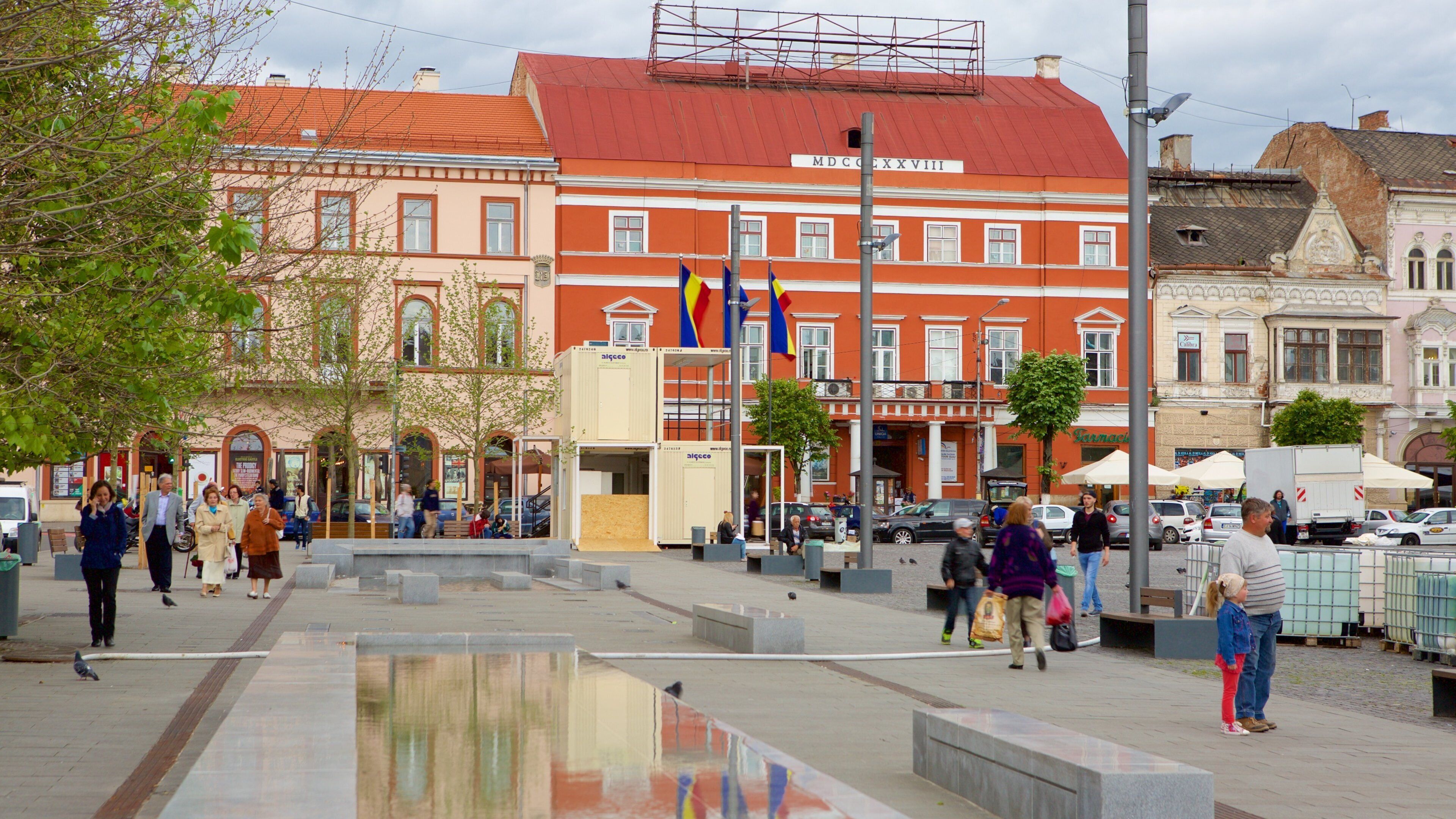 A public square with a red-roofed building labeled 'MDCCCLXXXVIII'.