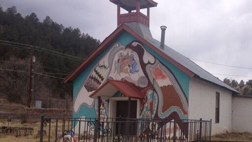 This interestingly painted church and adjacent cemetery is found alongside the road near the remote town of Montezuma.