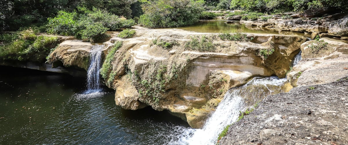 RIO BLANCO NATIONAL PARK, BELIZE - Sep 17, 2020: Santa Cruz falls along Blue Creek