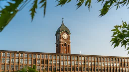 Iconic clock tower and nineteenth century brick mill building in the historic immigrant city of Lawrence Massachusetts.