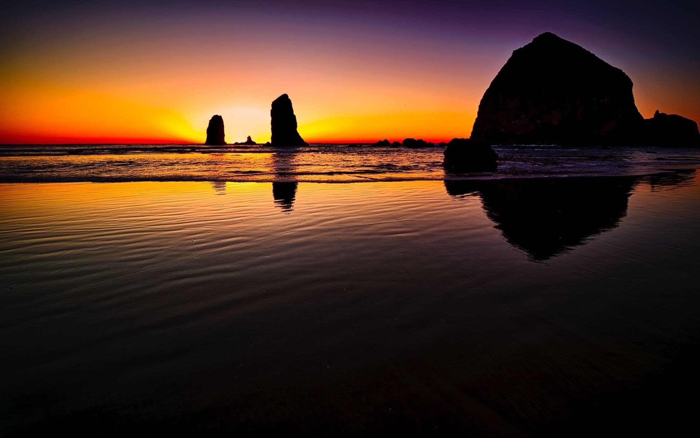 Sunset over the Needles and Haystack Rock. Located just off the beach in Cannon, Oregon.