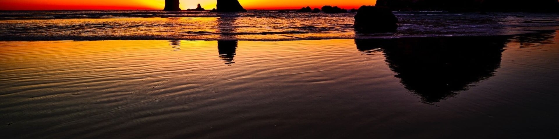 Sunset over the Needles and Haystack Rock. Located just off the beach in Cannon, Oregon.