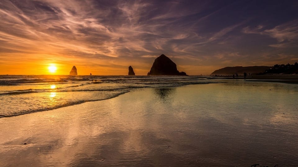 A sunset shot at Haystack Rock in Cannon Beach Oregon. One of the greatest places my wife and I have seen. You can see more of my work at www.tmcewenphotography.com