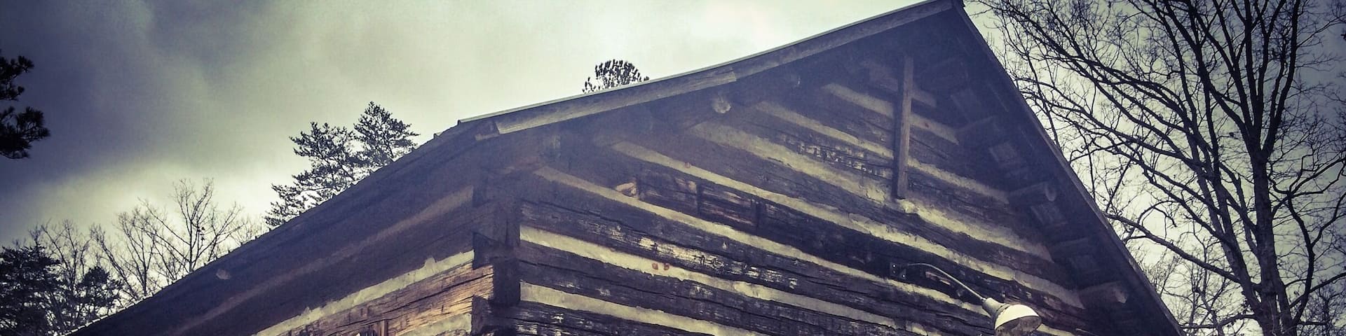 Nestled in the Bankhead National Forest, Pine Torch was built in 1850. Made from poplar logs with oak shingles and a tin roof, it's the perfect example of a log building from that era. It served as both church and school for the area. Nondenominational services are held every Sunday still. Pine Torch is part of the Hallelujah Trail of North Alabama which is a collection of churches over 100 years in age, still residing in the original church site and still holding services today. What a great view back in time prior to electric services for light and heat. You can smell the "oldness" in this one room structure.