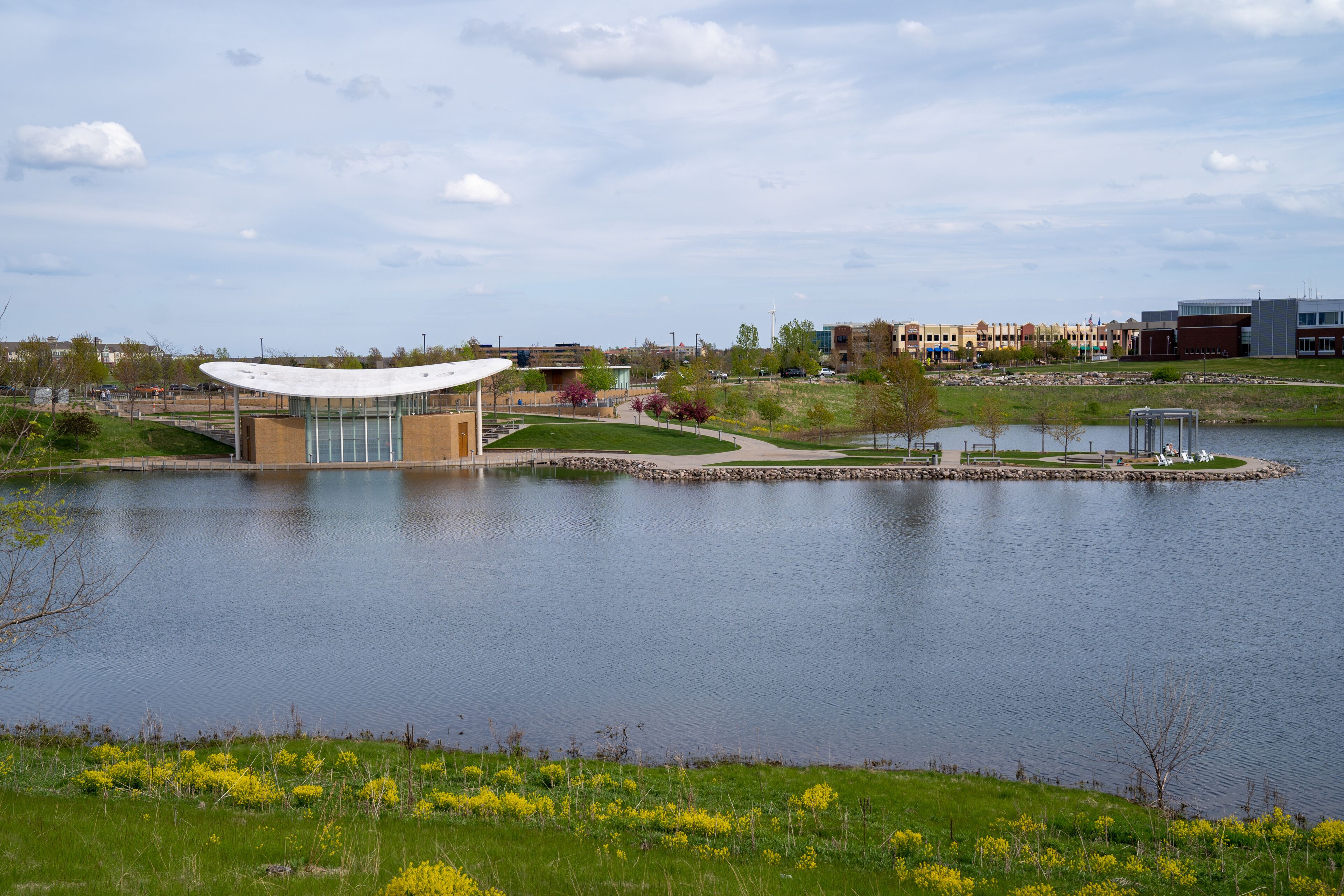 Maple Grove, Minnesota - View of the Town Green park and community outdoor bandshell on the lake