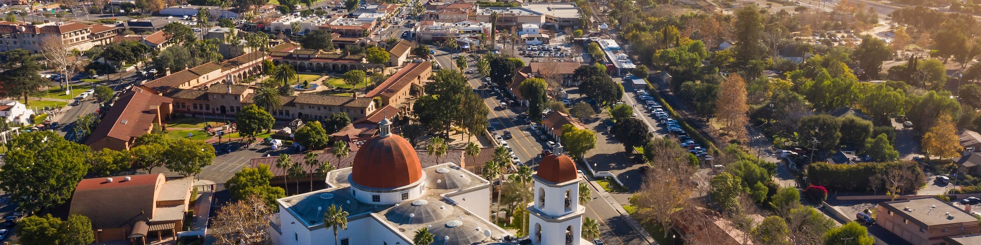 Daytime aerial view of the Spanish Colonial era mission and surrounding city of downtown San Juan Capistrano, California, USA.