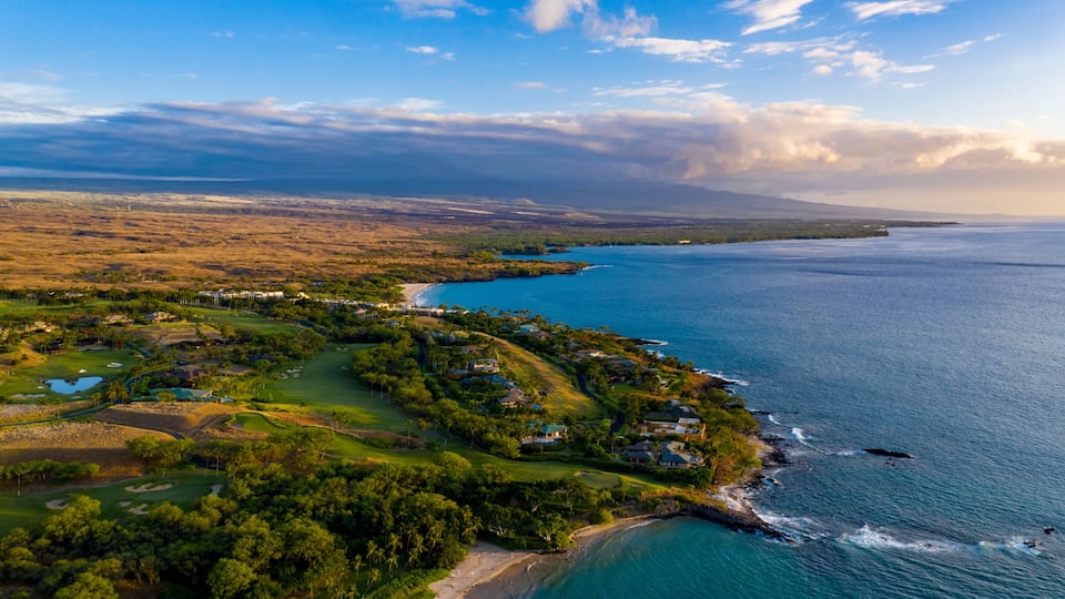 The Big Island's Kohala Coast with the dormant volcano of Hualalai in the distance