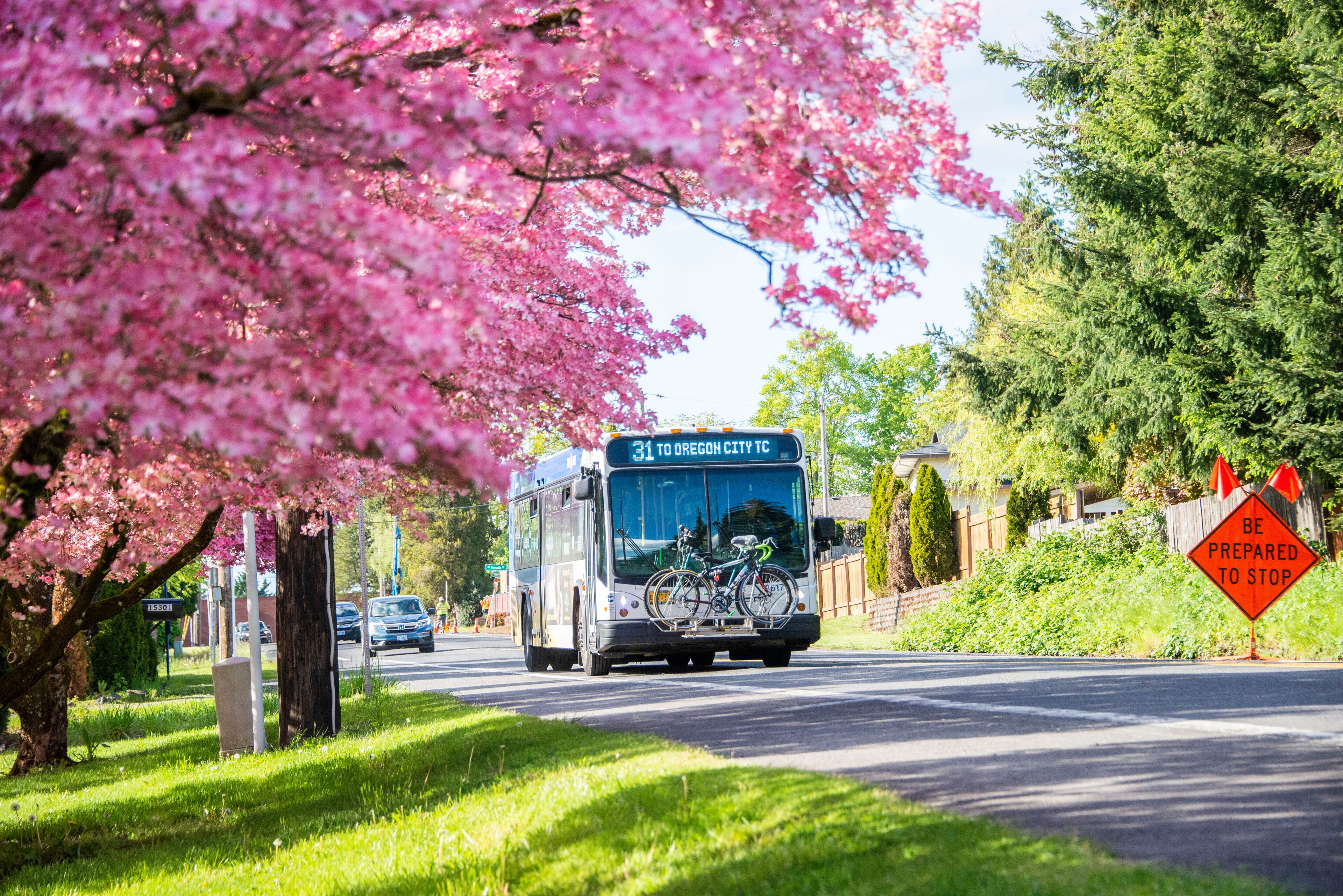 Milwaukie, Oregon, USA - May 10, 2022: Trimet bus travelling  on a spring day on its way to Oregon City. Milwaukie is known as The Dogwood City of the West.