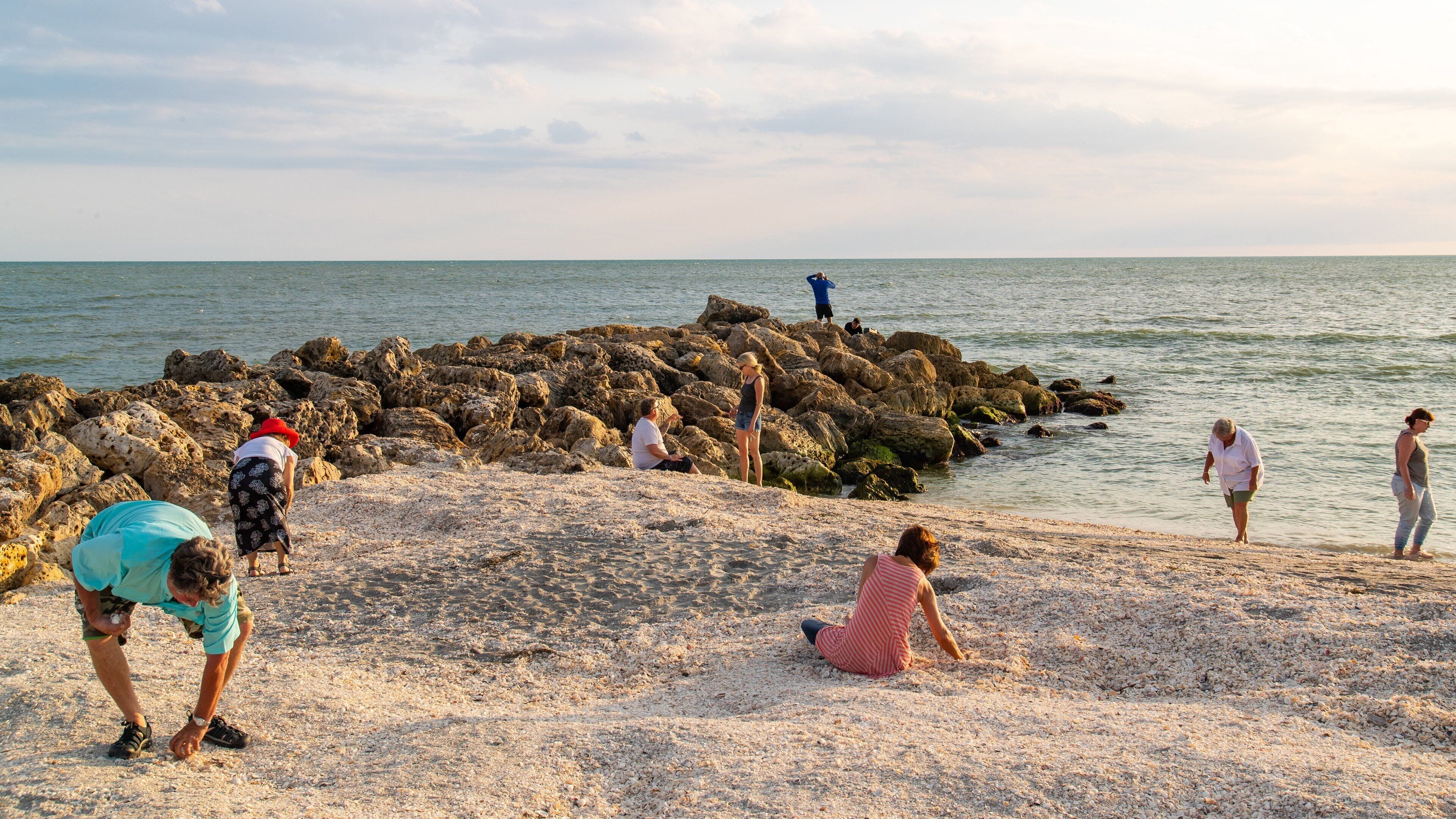 Captiva featuring a beach and general coastal views as well as a small group of people